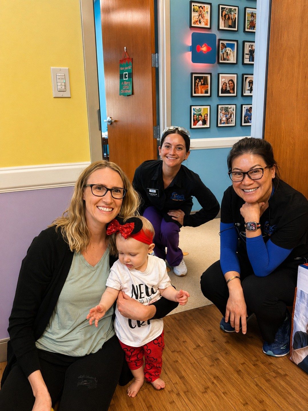 Dr. Tsai and team welcoming a baby and parent at a first visit